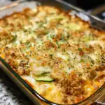 Delicious baked zucchini casserole topped with golden breadcrumbs and melted cheese, perfect for a comforting family dinner or side dish.